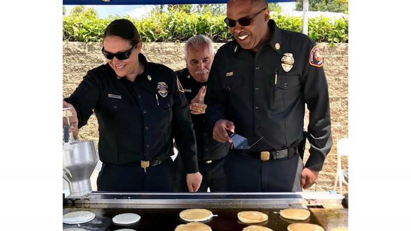 Chief Osby serving up pancakes.