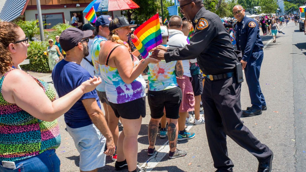Chief Osby greeting people at Pride Day.