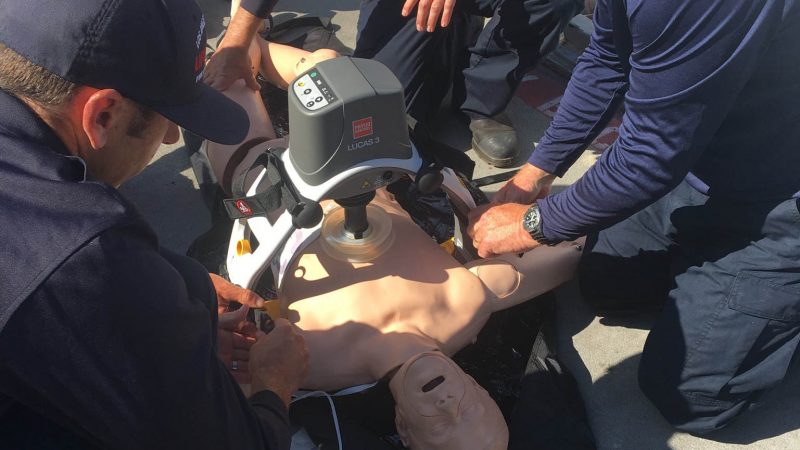 CPR dummy being used for cardia arrest.