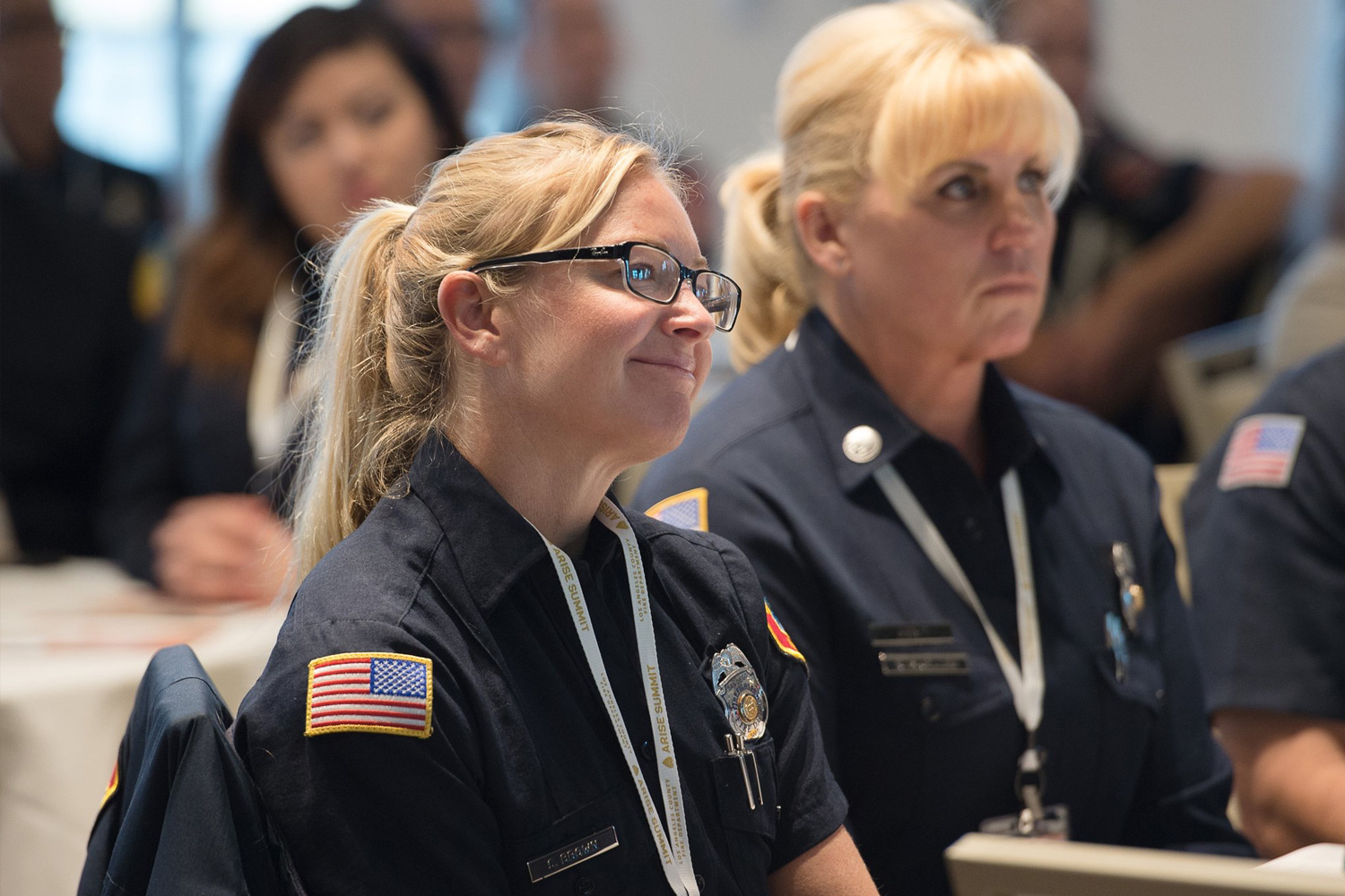 Two Women listening to a speech