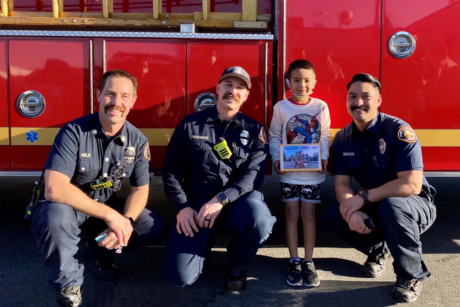 Firefighters reunite with young boy who tragically lost his mother.