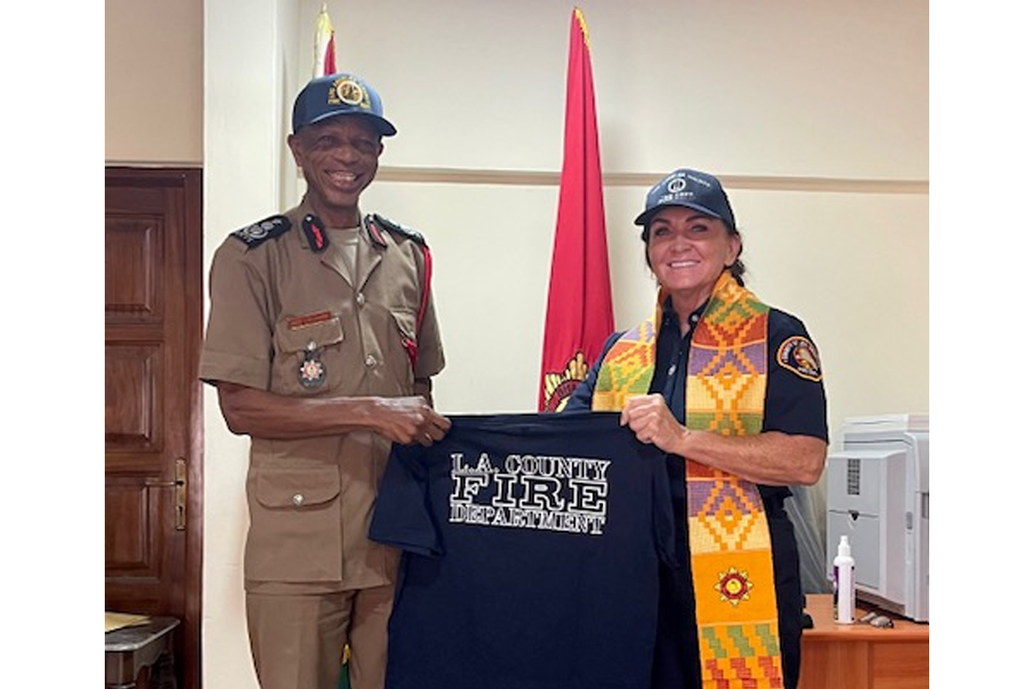 While on vacation with her family, Captain Sheila Kelliher from the Public Information Office met with the Chief of the Ghana National Fire Service.