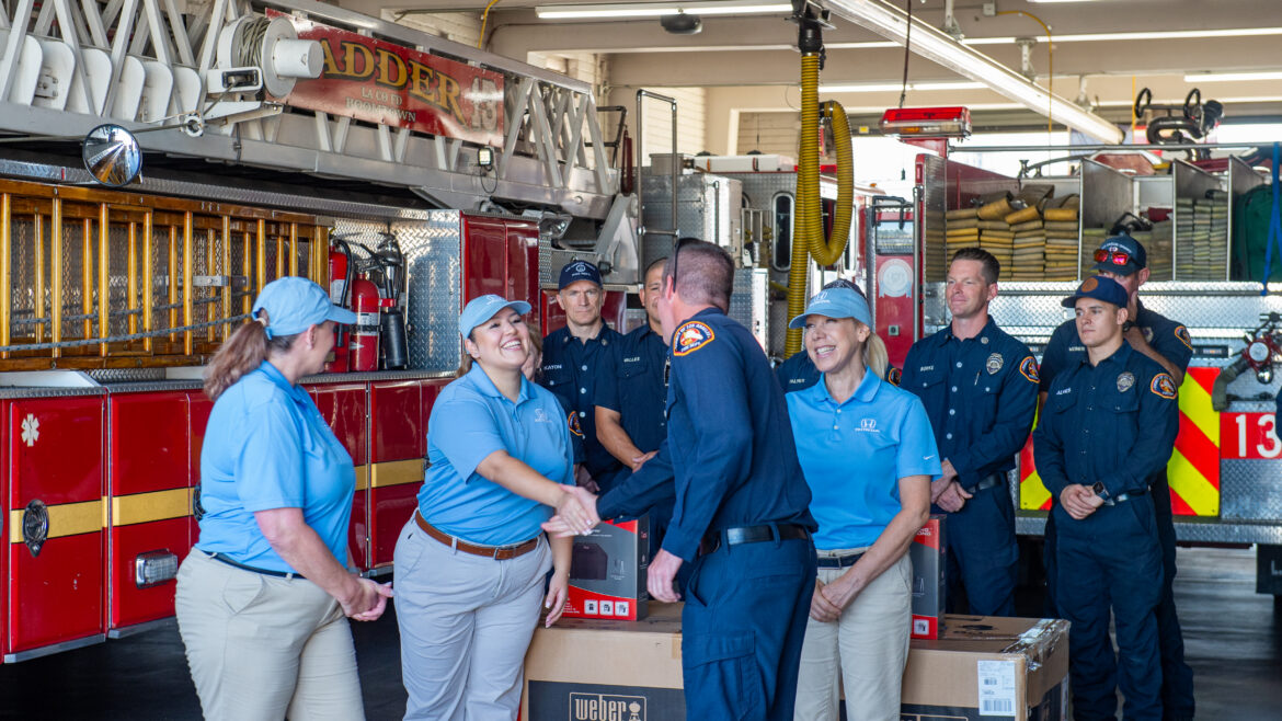 Fire Chief Anthony C. Marrone, the Los Angeles County Firefighters Benefit and Welfare Association (B&WA), and station firefighters teamed up with Helpful Honda to surprise Fire Fighter Specialist (FFS) Germain Aguilera and his family with a $1,000 check.